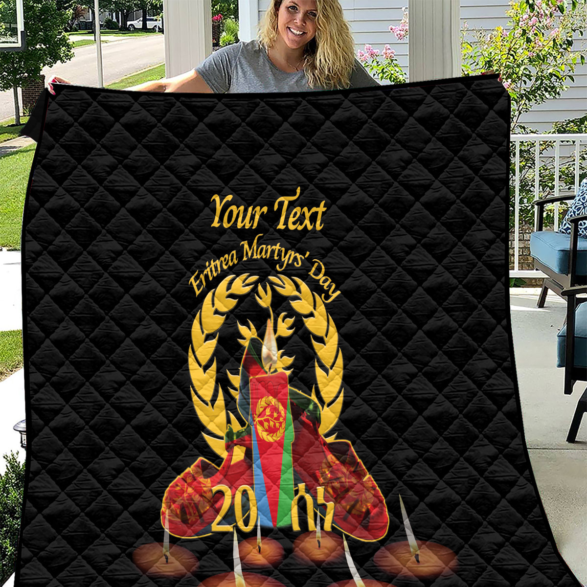 Black quilt with Eritrea Martyrs' Day graphic, candles, and personalized text in center
