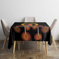 Black tablecloth featuring printed candles on tabletop with matching drape