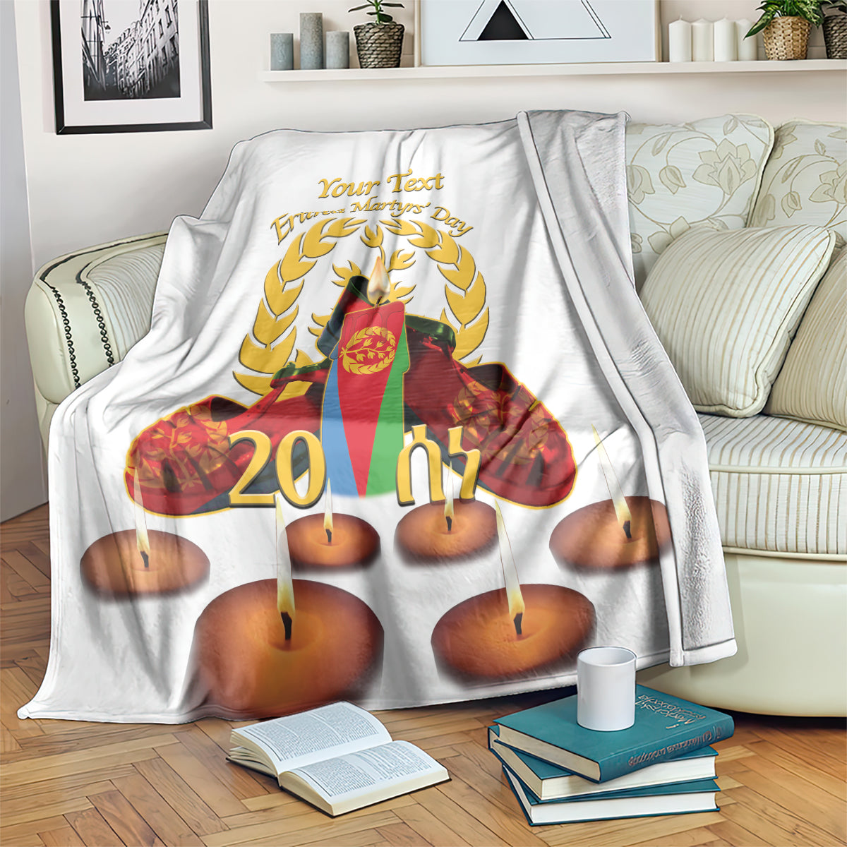 White throw blanket with laurel wreath, candles, and “Your Text” graphic
