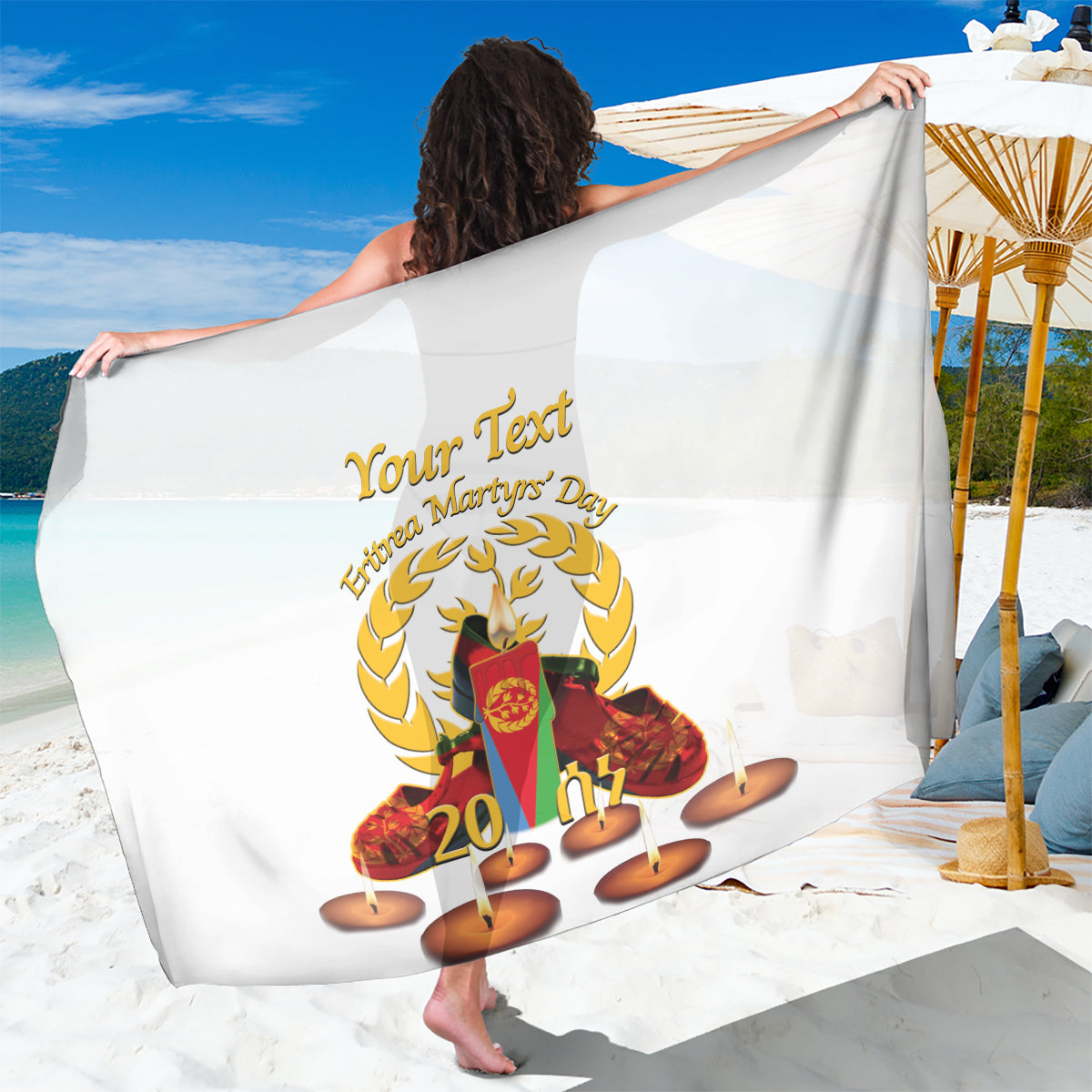 White sarong with gold crest, candle graphics, and “20” printed design