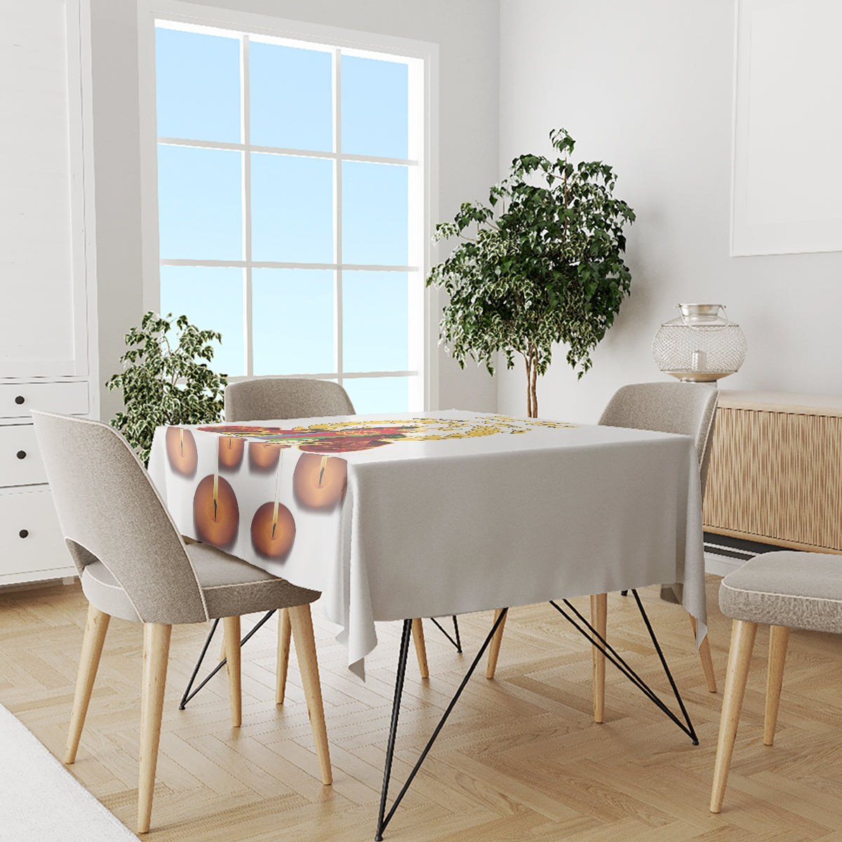 White tablecloth with candle-flame print on dining table in bright room
