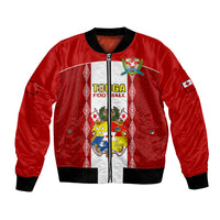 Red bomber jacket with black ribbed cuffs, zip front, and Tongan ngatu style crest