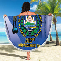 Blue round beach blanket with fringed edge, large emblem and parrot bird graphic