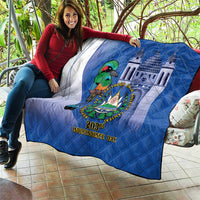 Blue quilt with white curved panel and central bird emblem, “203rd Independence Day” text