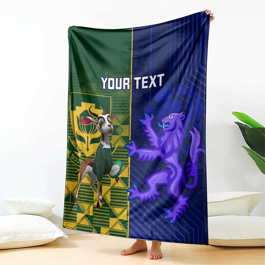 Rugby blanket draped showing green crest side, blue lion side, "YOUR TEXT"