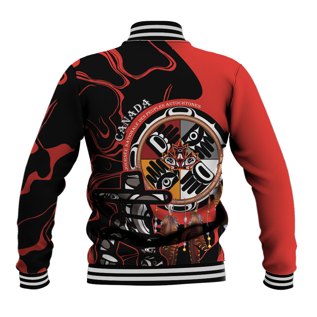 Red/black baseball jacket with large back Indigenous-style emblem, striped ribbed collar
