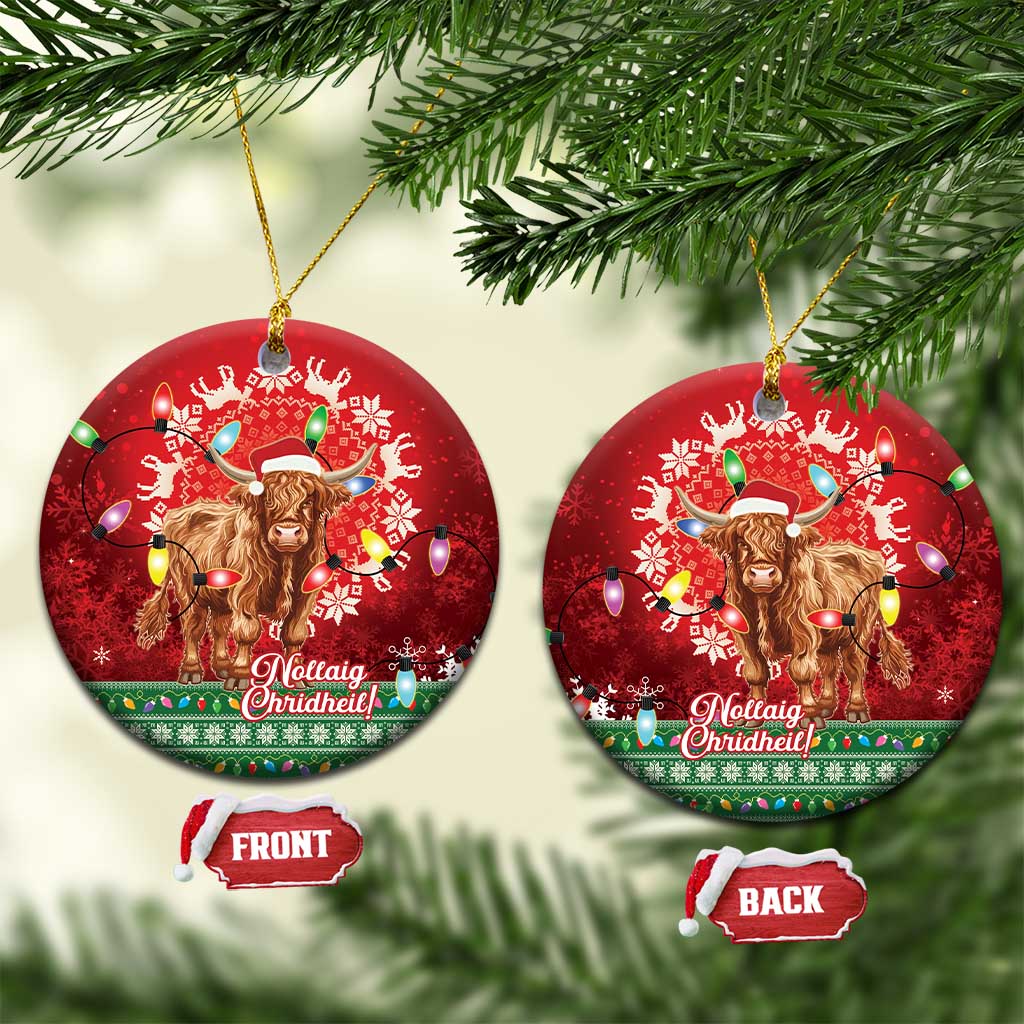 Red round ceramic ornament pair with Highland cow Santa hat and hanging light bulbs.