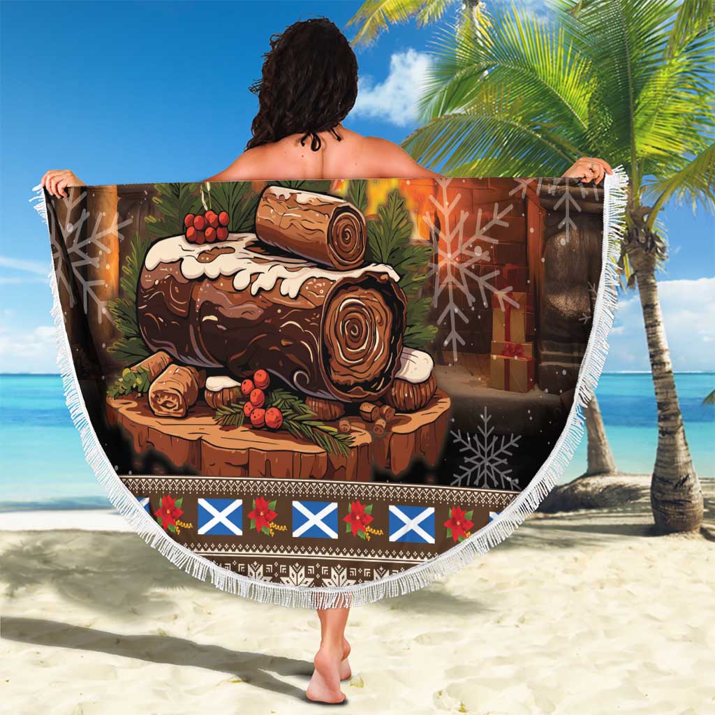 Holiday round beach blanket with fringe trim and "Merry Yule Log" printed design