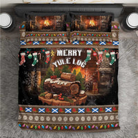 Christmas bedding set with black “Merry Yule Log” design, stockings, snowflakes, and log art