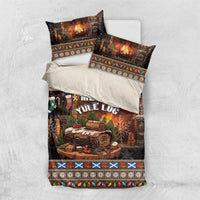 Christmas bedding set with black “Merry Yule Log” duvet and matching pillowcases, festive border