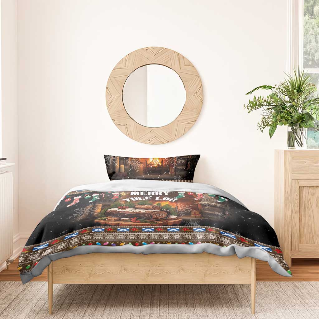 Christmas bedding set with black “Merry Yule Log” top design, colorful trim band, and log illustration
