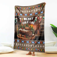 Christmas throw blanket featuring “Merry Yule Log” text and colorful pattern border, standing