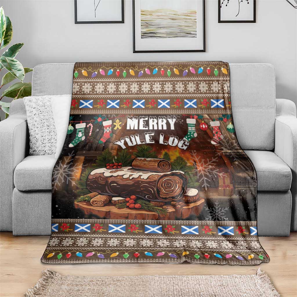 Merry Yule Log Christmas blanket with dark brown forest scene and festive trim, on a sofa