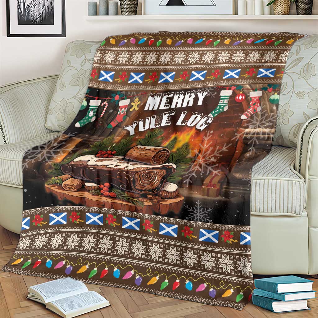 Christmas blanket with “Merry Yule Log” graphic, colorful stripes, and festive border on sofa