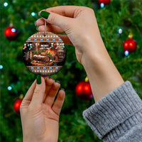Round ceramic Christmas ornament with Merry Yule Log design, hanging gold string