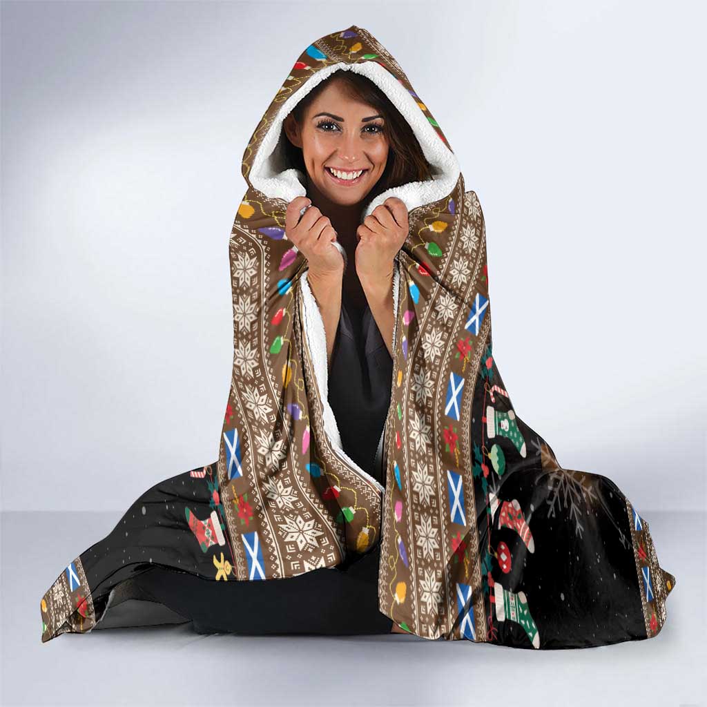 Christmas hooded blanket worn as a cape with Merry Yule Log design and colorful trim