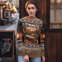 Brown ugly Christmas sweater with Merry Yule Log front graphic and colorful patterned yoke