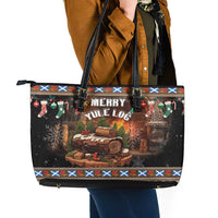Black Merry Yule Log tote bag with patterned trim, top zipper, and dark leather handles