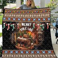 Dark quilt with Merry Yule Log print, fire scene, stockings, and multicolor border edging.