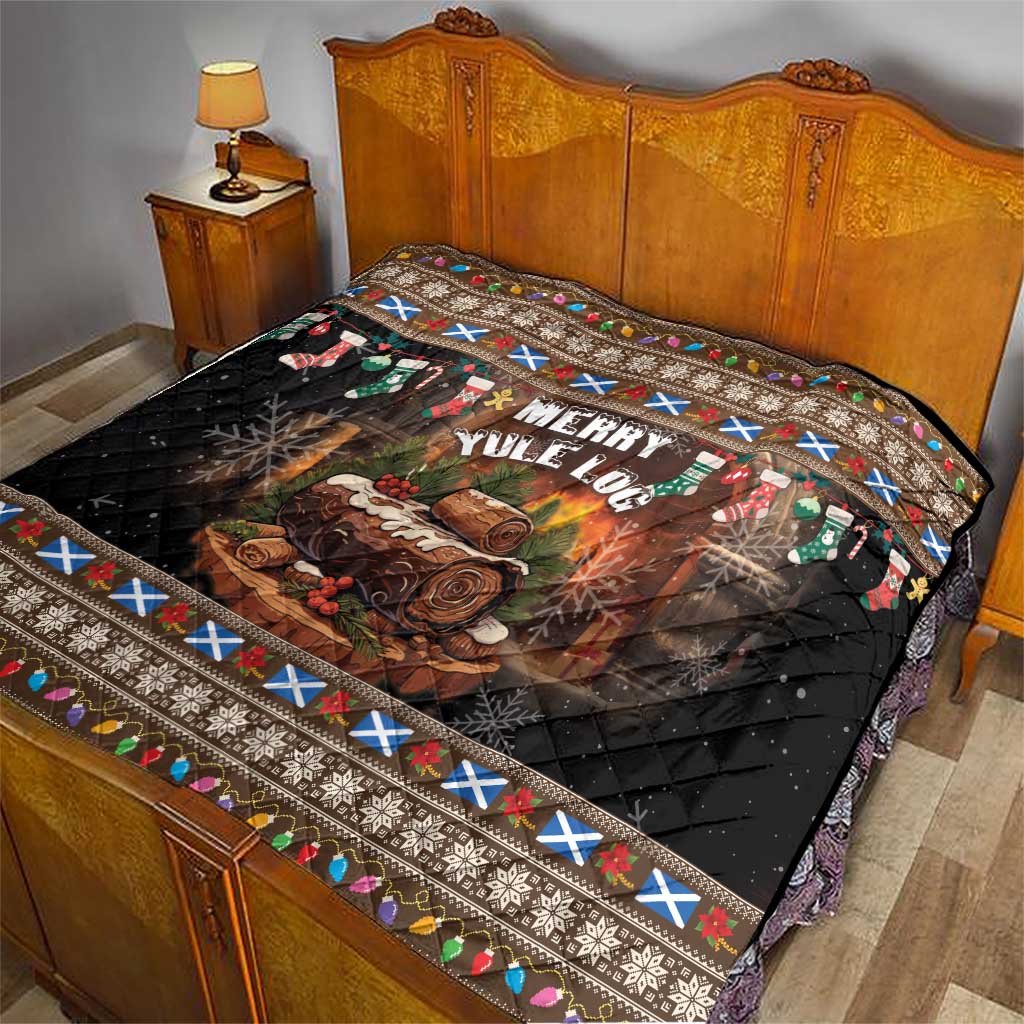 Dark quilt with Merry Yule Log print, log flames, and multicolor folk border on bed.