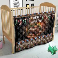 Dark quilt with Merry Yule Log print and festive border, on a baby bed frame.