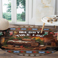 Round Christmas rug with "Merry Yule Log" text, log slices, and patterned blue trim