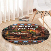 Round Christmas area rug with brown log artwork, "Merry Yule Log" headline, border