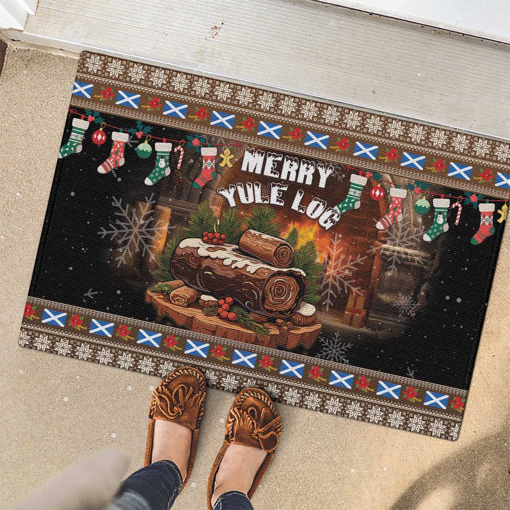 Brown rubber Christmas doormat with 'Merry Yule Log' design, log slice, stockings, patterned edge
