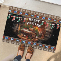 Brown rubber Christmas doormat with 'Merry Yule Log' design, log slice, stockings, patterned edge