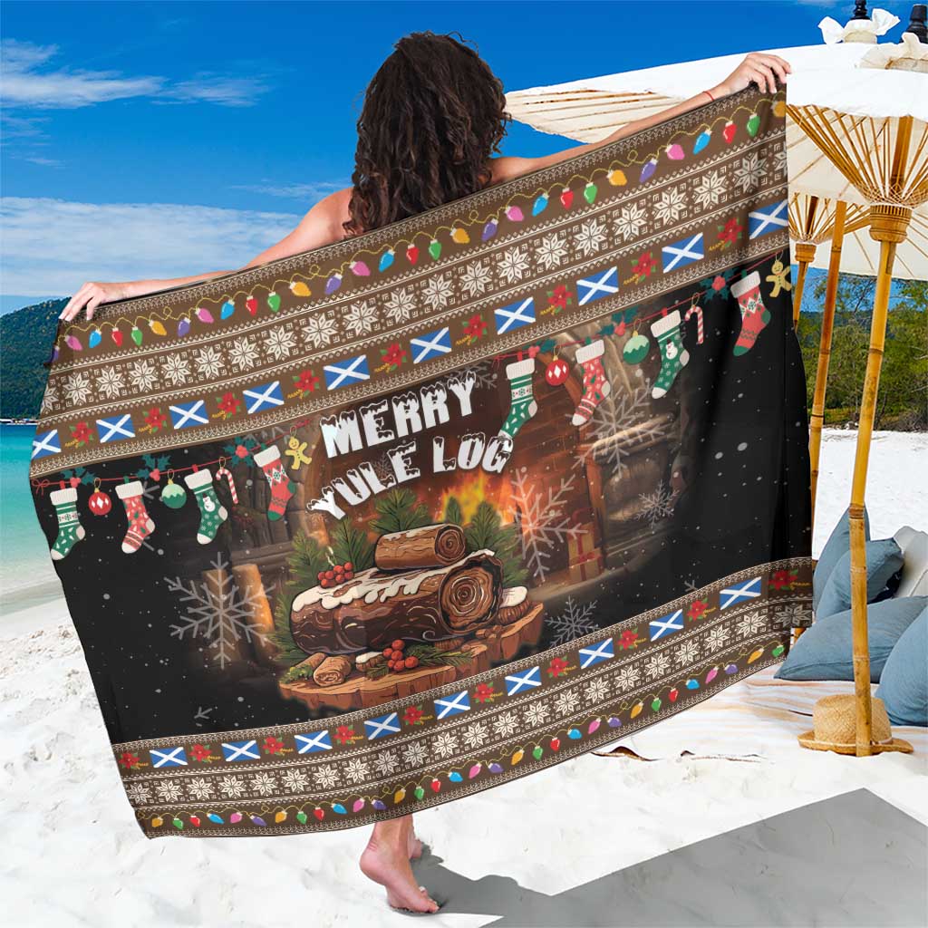 Brown Christmas sarong with 'Merry Yule Log' print and festive border trim