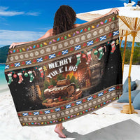 Brown Christmas sarong with 'Merry Yule Log' print and festive border trim