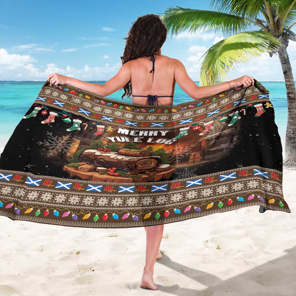 Brown and black Merry Yule Log sarong with holiday border, spread flat