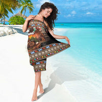 Brown holiday sarong with 'Merry Yule Log' graphic and multicolor border
