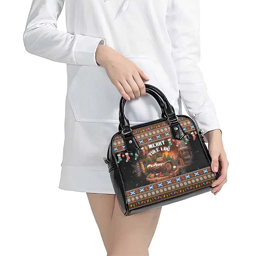 Black festive print handbag with dual handles and zipper top for shoulder carry