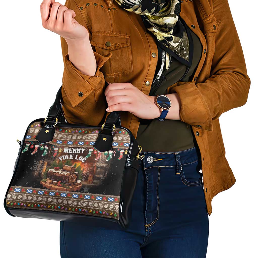 Black festive print handbag with top handles, zipper closure, and shoulder strap
