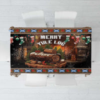 Dark brown Christmas tablecloth with “Merry Yule” text and log centerpiece, colorful border.
