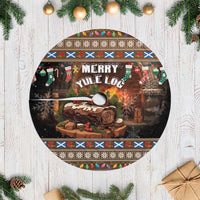 Round Christmas tree skirt, brown and dark with “Merry Yule Log” graphic, white fringe