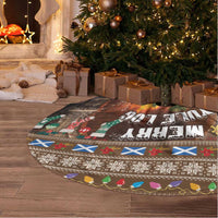 Round Christmas tree skirt with log-themed print and patterned border, fringed edge