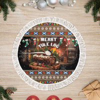 Round Christmas tree skirt with “Merry Yule Log” design and full white tassel fringe