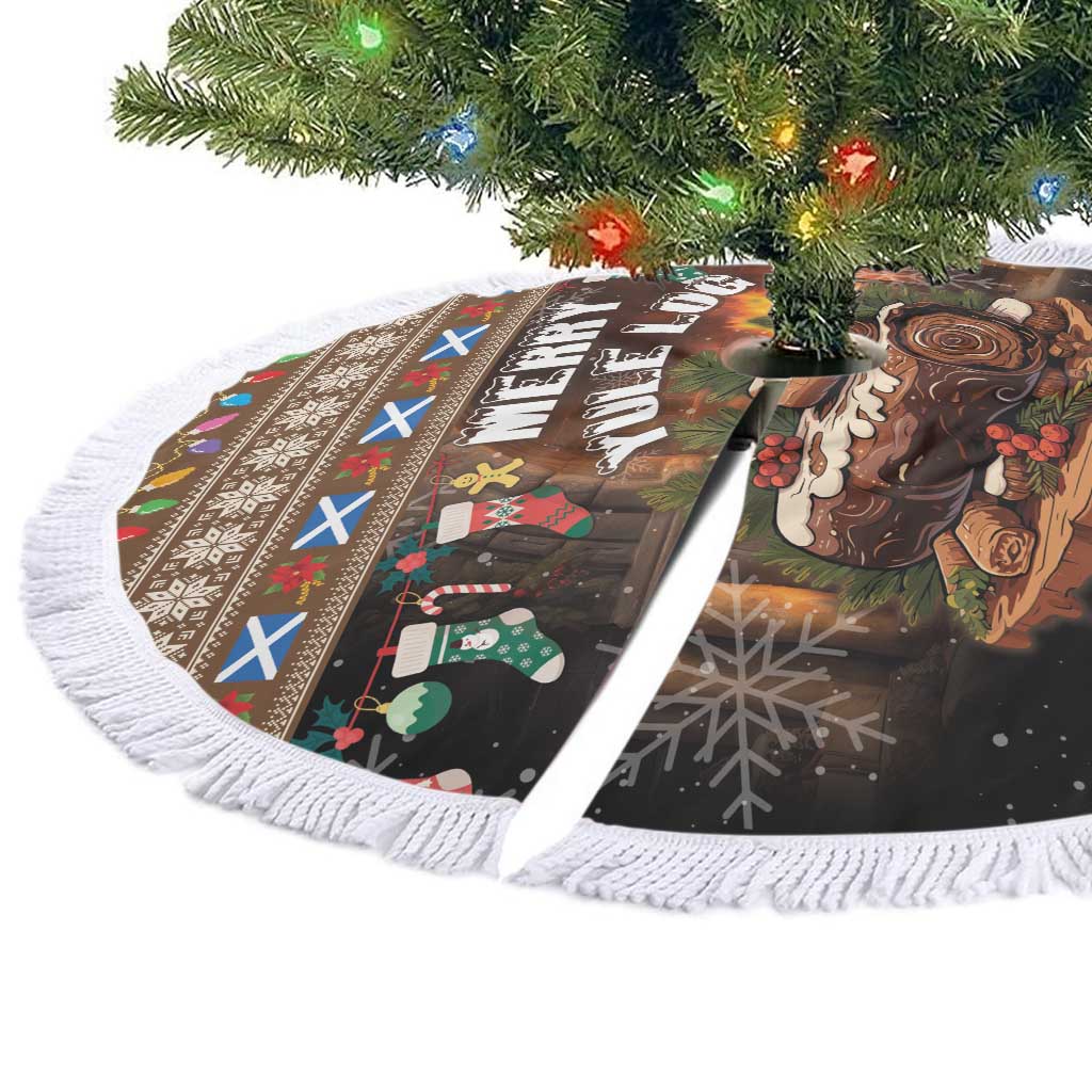 Round Christmas tree skirt with “Merry Yule Log” artwork and white tassel fringe border