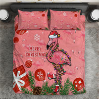 Pink Christmas bedding set with two pillowcases, cartoon flamingo and “Merry Christmas” text.