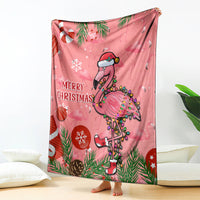Pink Christmas blanket with cartoon flamingo, pine leaves, and red “Merry Christmas”
