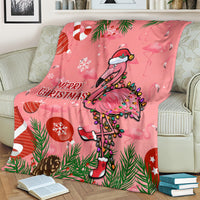Pink Christmas blanket featuring cartoon flamingo and “Merry Christmas” lettering