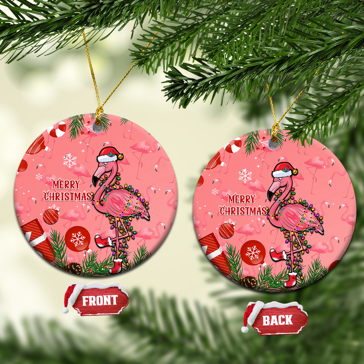 Pink round ceramic Christmas ornament with flamingo, wreath, and “Merry Christmas” text