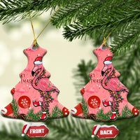 Pair of pink bell-shaped ceramic ornaments with flamingo, “Merry Christmas” text