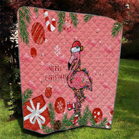 Pink quilted Christmas throw featuring a flamingo with “Merry Christmas” and red ornaments