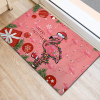 Pink flamingo Christmas doormat angled view with 'Merry Christmas' and star accents