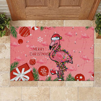 Pink Christmas rubber doormat featuring flamingo with 'Merry Christmas' and snowflake icons