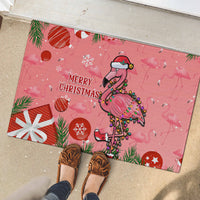 Pink flamingo Christmas rubber doormat with 'Merry Christmas' and red ornament shapes