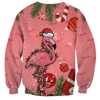 Pink Christmas sweatshirt with flamingo in Santa hat and green skirt; snowflake and candy cane